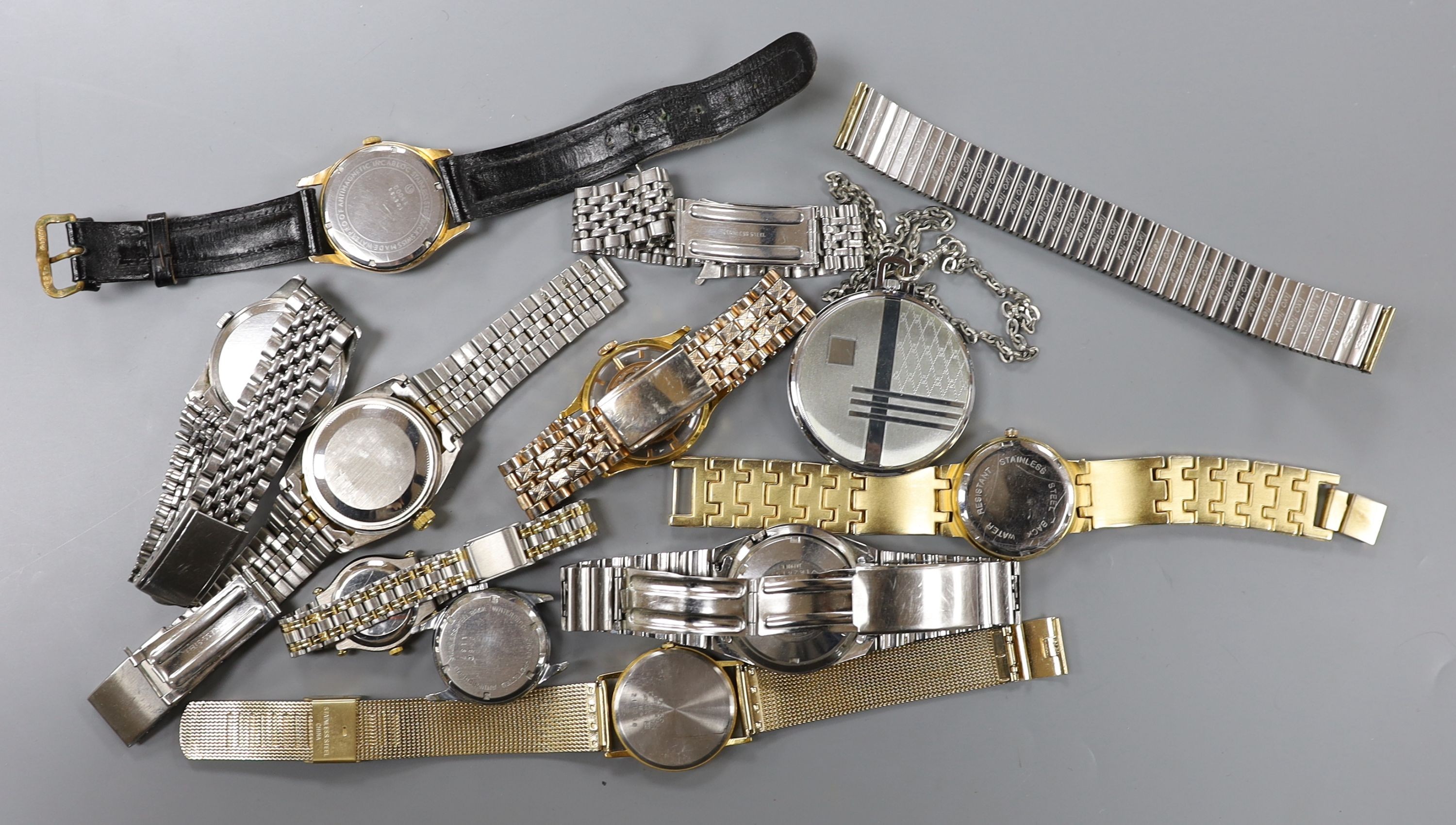 A gentleman's mid 20th century stainless steel Omega manual wrist watch, case diameter 35mm, on associated bracelet, together with eight other assorted wrist watches including Seiko and Silvan, an Oris pocket watch and t